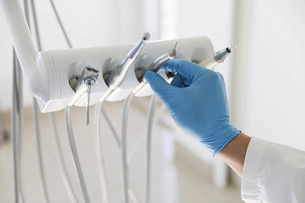 Professional Tooth Extraction technician working in Lenoir, NC